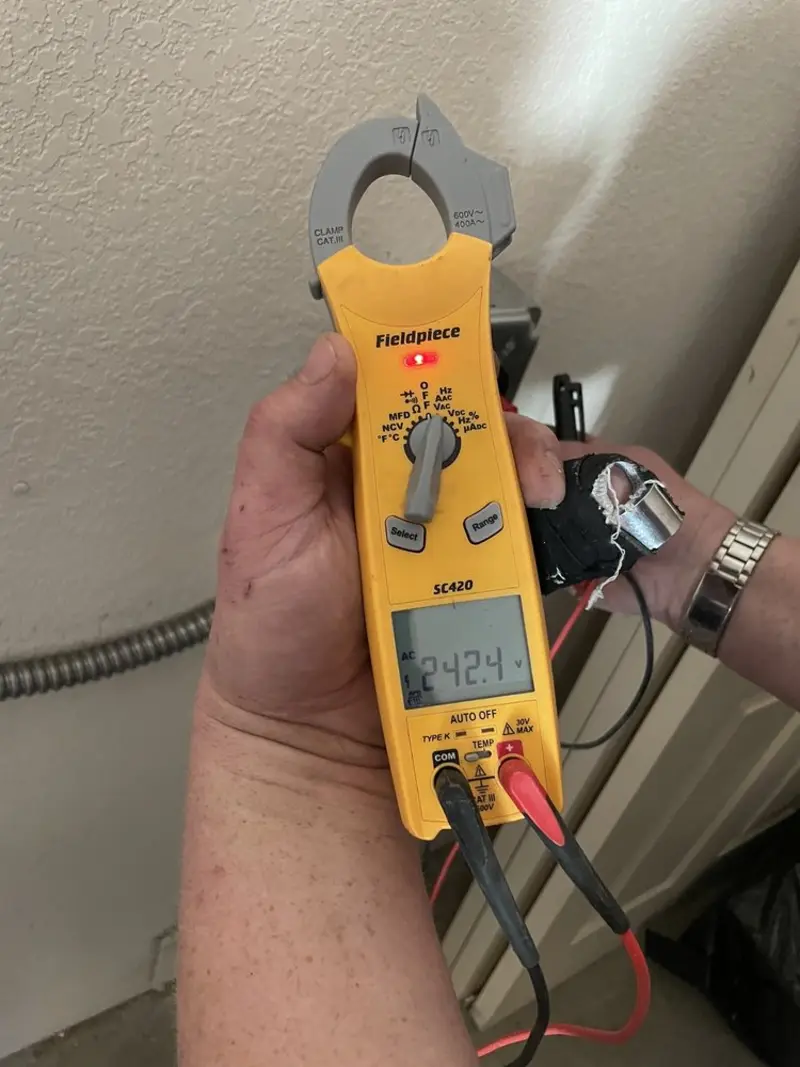 Voltage testing with clamp meter during Electrical Installation Services in Lockhart
